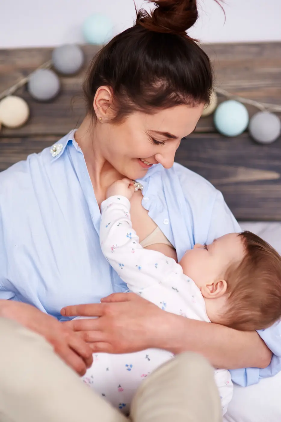 A mother holding her baby close