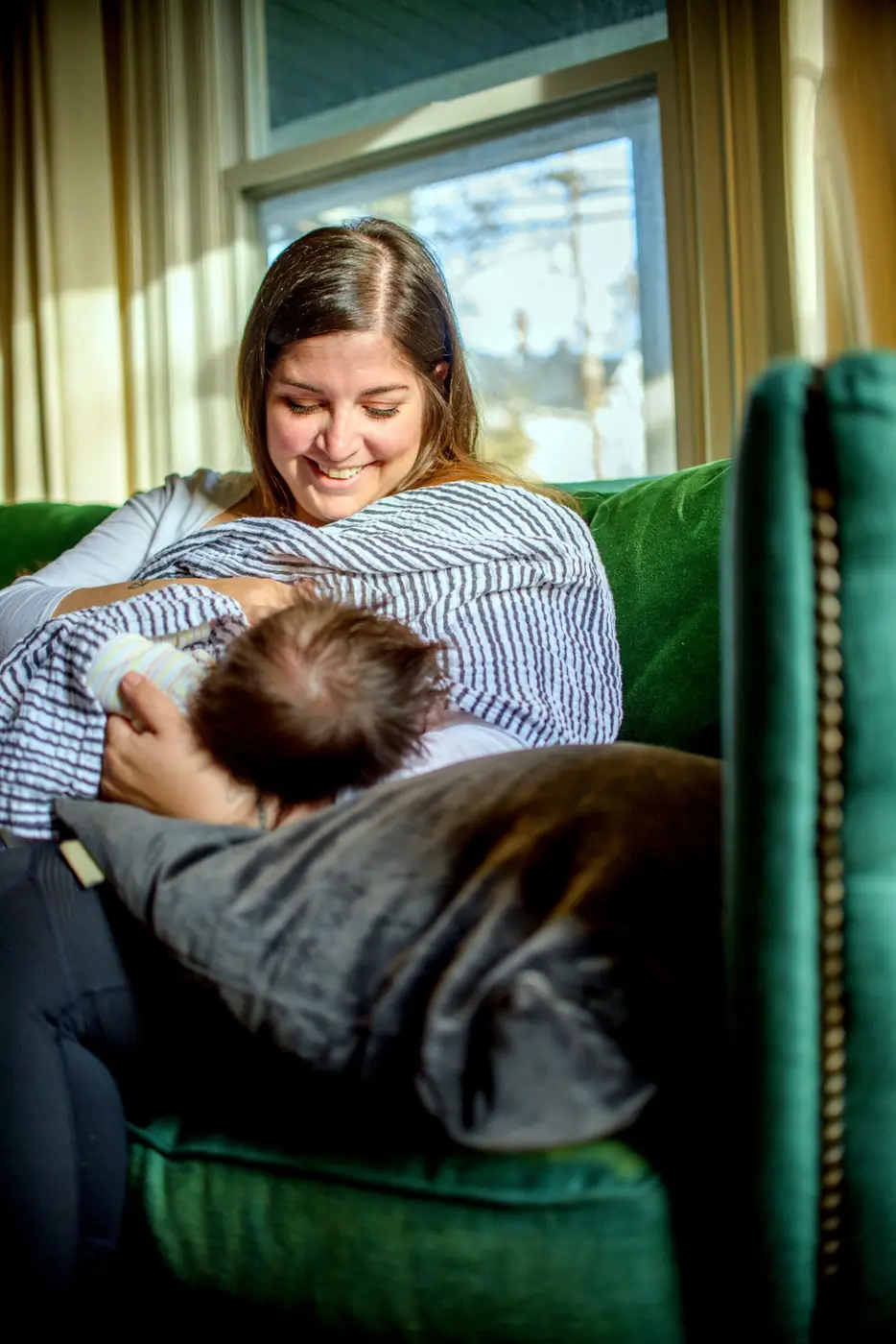 A mother comforting her infant at home